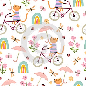 Spring seamless pattern with cartoon cats on bicycles, flowers, rainbows, umbrella, dÃÂ©cor elements.